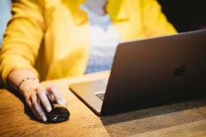 Person using a computer looking at a web design
